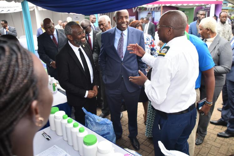 CS Machogu visits one of the exhibition stands
