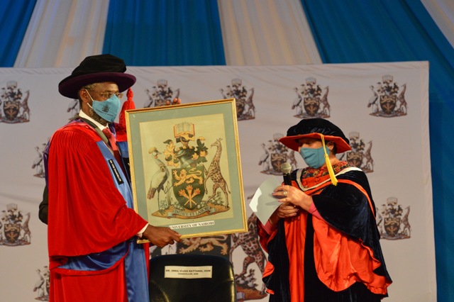 Prof. Kiama receives instruments of power during the VCs installation