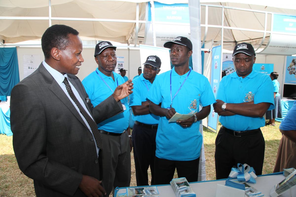 The former DVC Academic Affairs Prof. Kaimenyi tours the Commission for Higher Education (CHE)  Exhibition in Embu