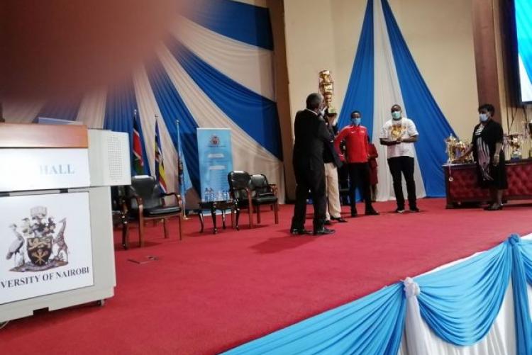 Prof. Stephen Kiama handing over trophies during the UoN 2020 sports recognition and  awards ceremony. 