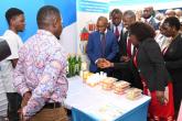 Safaricom CEO, UoN Vice Chancellor and other officials interact with exhibitors 
