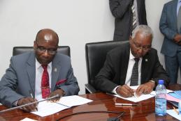 The Deputy Vice Chancellor Academic Affairs and the Academic Registrar signing the 2019/2020 Performance Contracting with the Vice-Chancellor