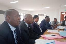 Mr. H.O.D.  Webuye (second in the picture) during the Academic Division Performance Contract mid-term review.